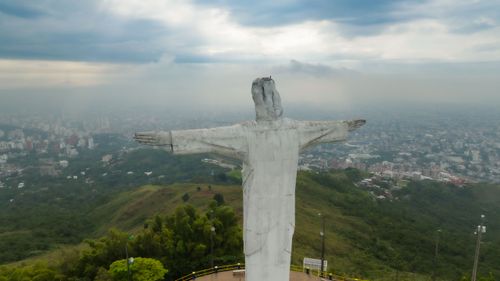 Free Aerial view of the Cristo Rey statue overlooking the city of Cali, Colombia. Stock Photo