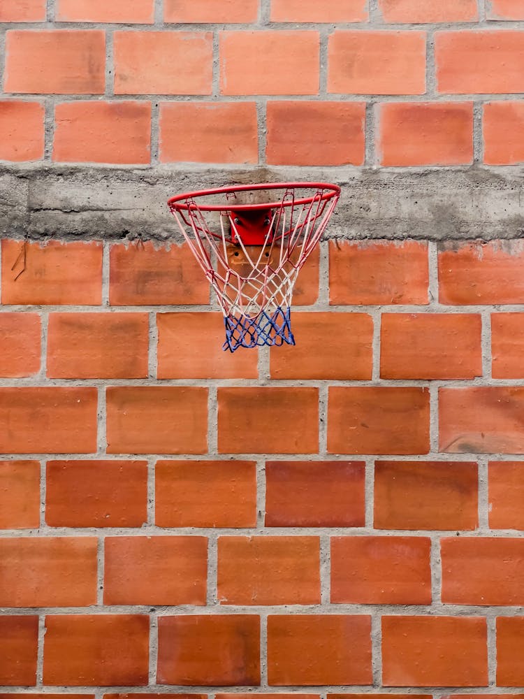 Basketball Hoop On Red Brick Wall