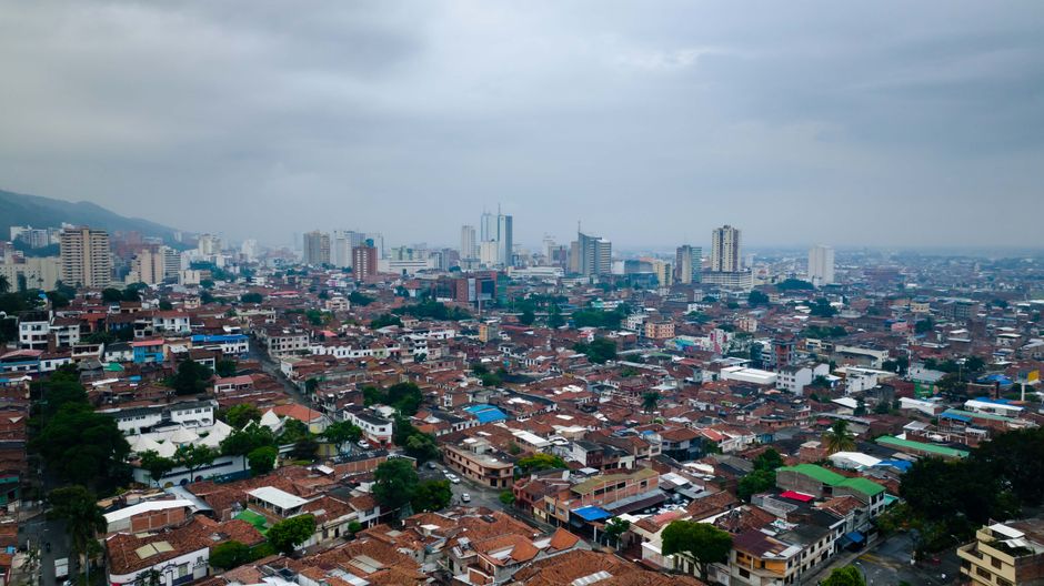 Ultimate Colombia: See & Experience ALL in 11 Days, 1st Class Custom Tours Review 2026 - Aerial shot of the bustling cityscape of Cali, showcasing its diverse architecture.