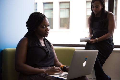 Woman Wearing Black Blouse Holding White Laptop