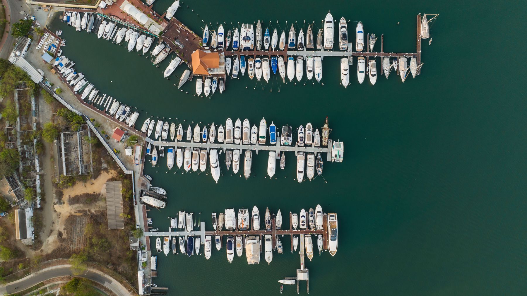 Aerial marina with yachts and sailboats