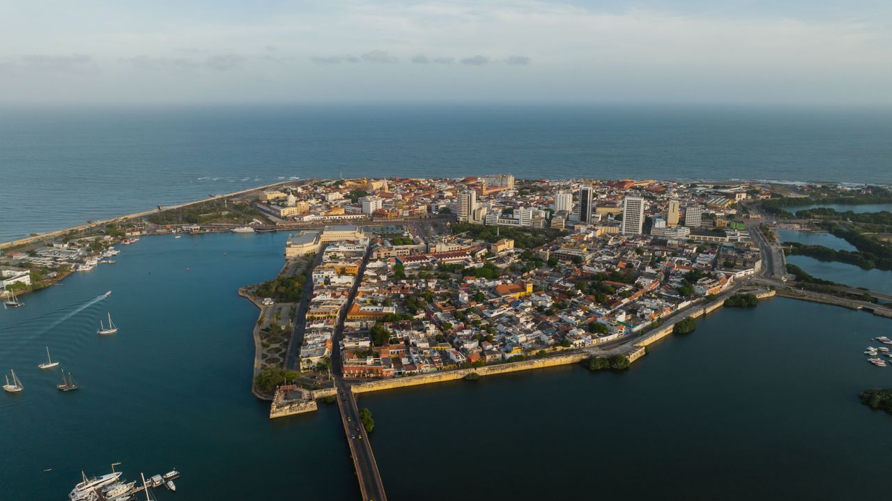 a stunning aerial view capturing a vibrant coastal city bordered by th