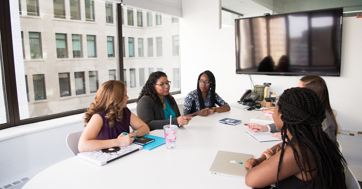 Group of Five Women Gathering Inside Office