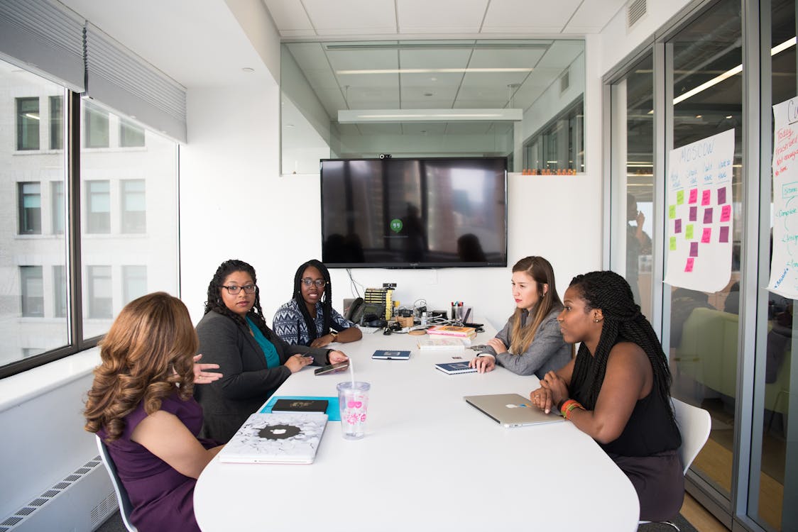 Free Group Of Women Gathered Inside Conference Room  Stock Photo
