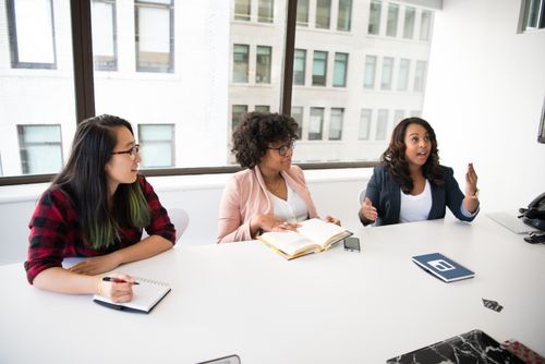 Free Diverse group of women collaborating in a bright modern office setting. Stock Photo