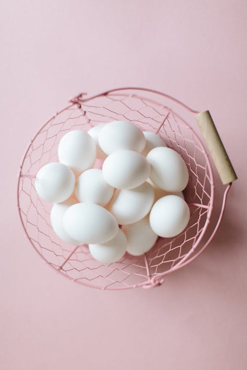 White Eggs Lying in Pink Bowl