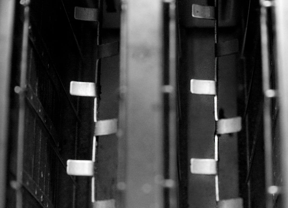 Music producer using a laptop with audio software and AI tools