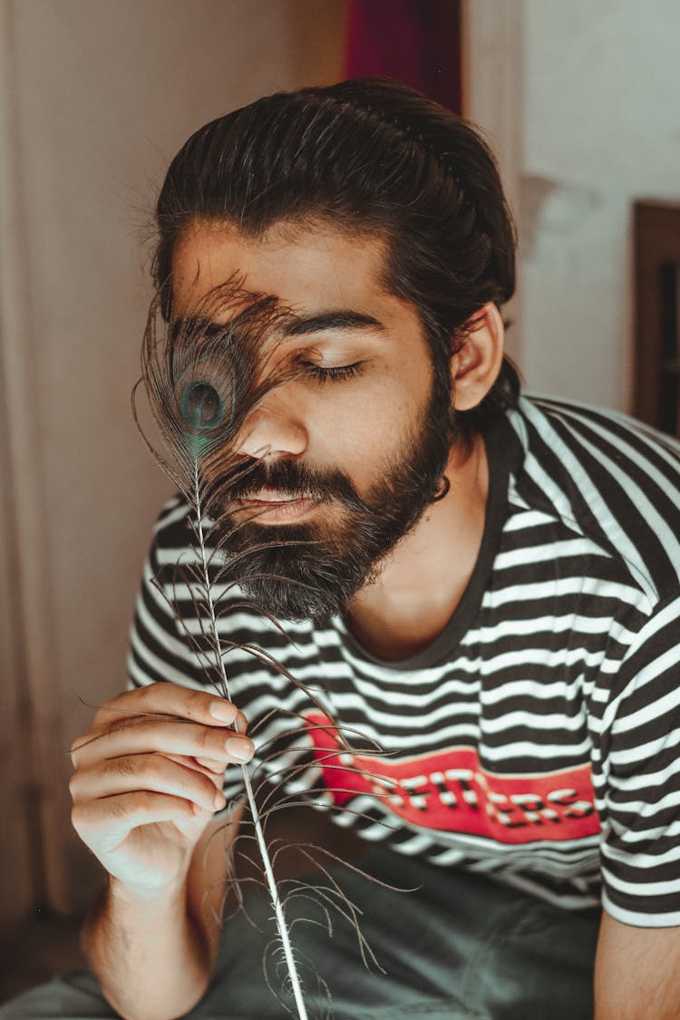  Peacock Feather On The Man's Face