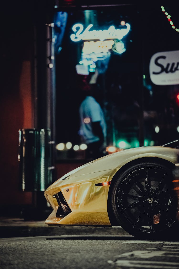 Yellow Sports Car In A City Street