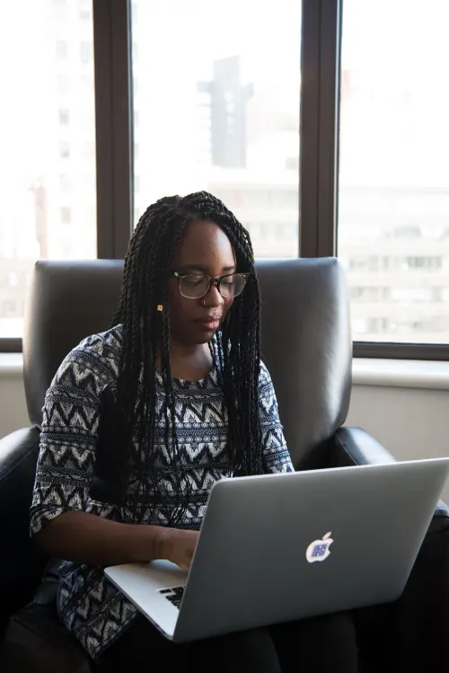 Candidate celebrating her offer letter at her desk