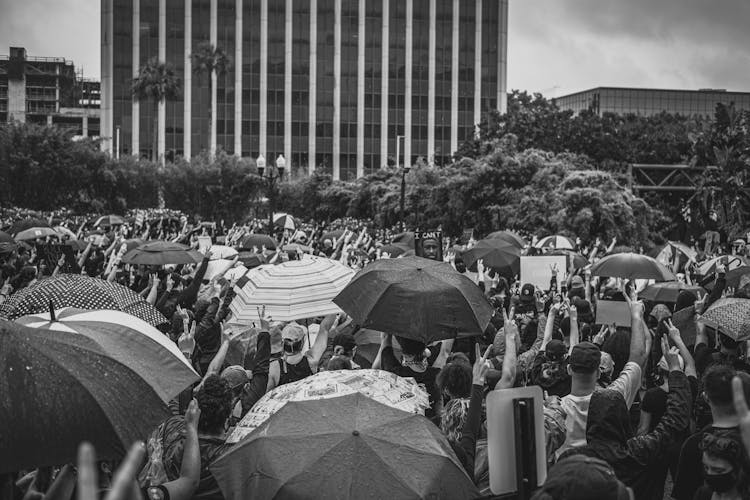 Grayscale Photo Of People On Park