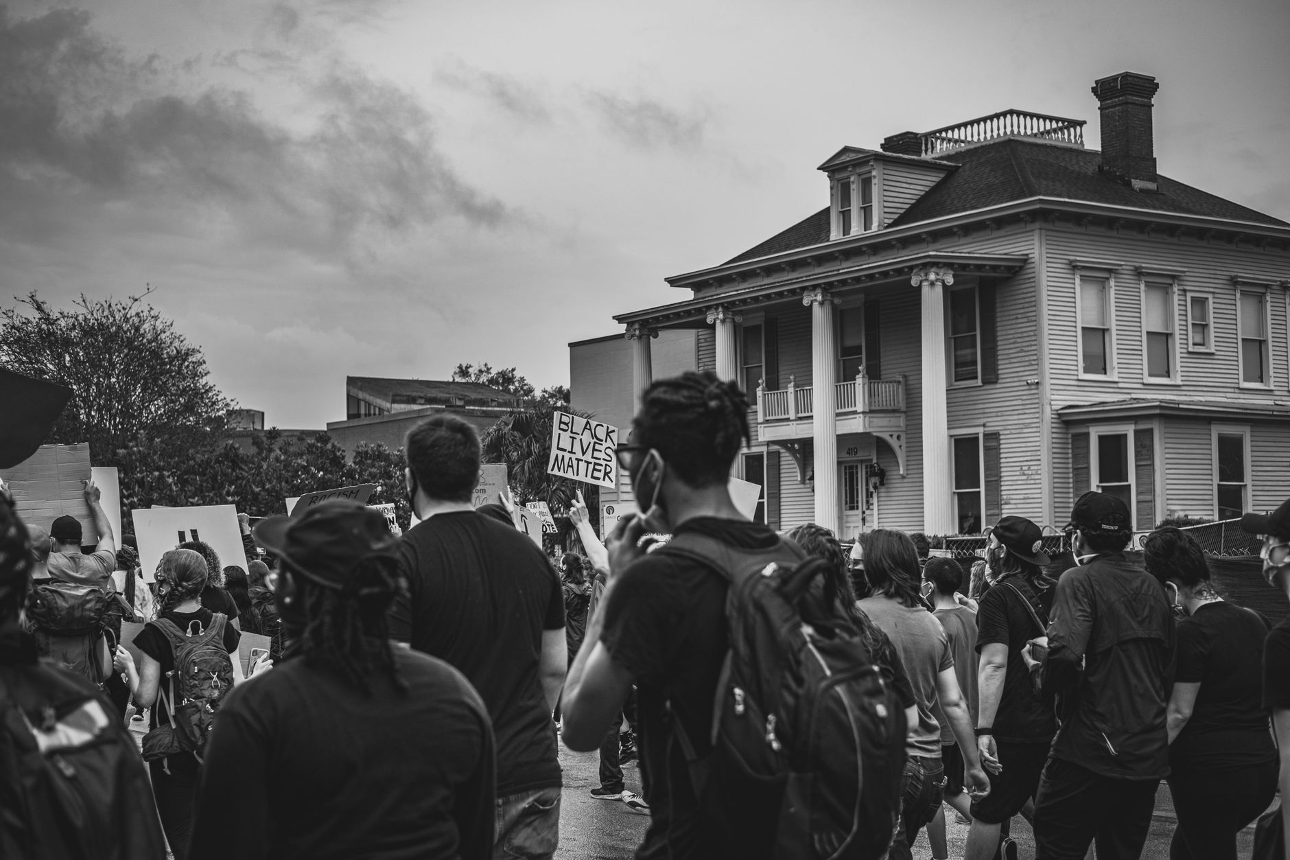 Black and white photo of a peaceful protest for Black Lives Matter movement.