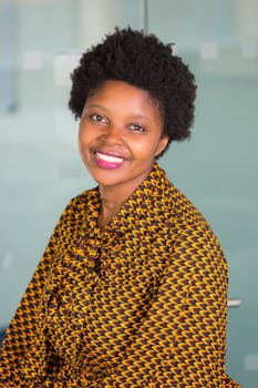 Bright and cheerful portrait of a woman in vibrant African print.