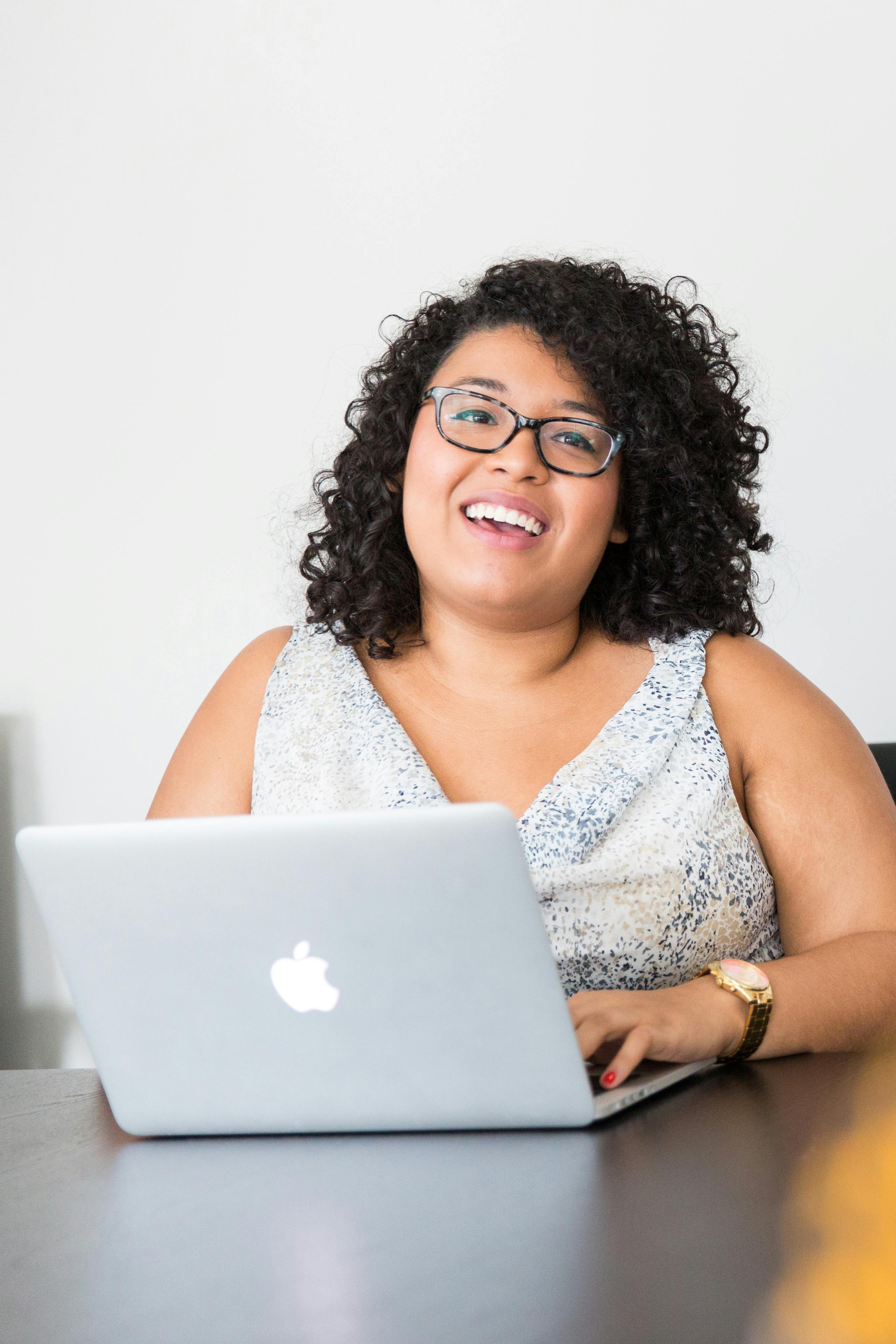 photography of woman using laptop