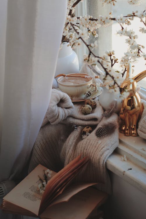 Cup of Coffee and Book on Windowsill