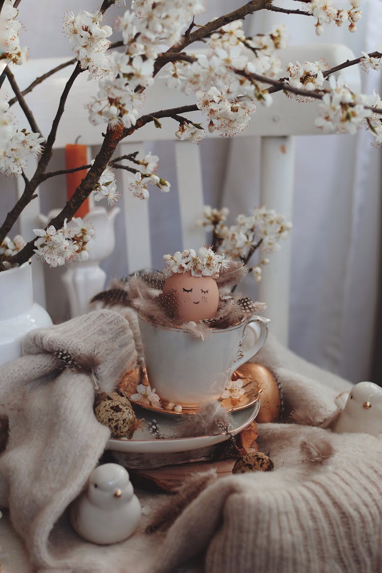 Photo Of An Easter Composite Of A Teacup, Eggs And A Cherry Blossom