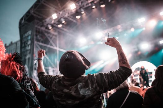 Dynamic crowd at an outdoor concert in A Coruña, Spain, capturing vibrant energy and celebration.