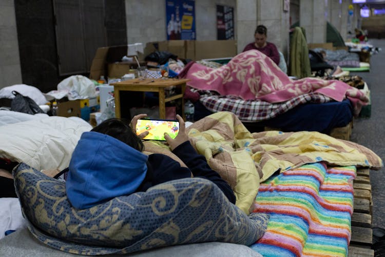 Women Resting In An Evacuation Center