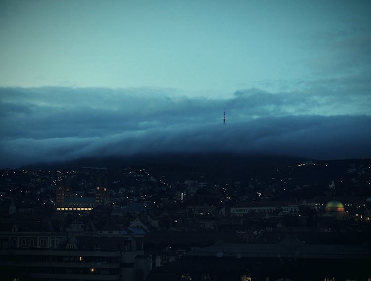 Scenic View Of The Dark Clouds Above The Town