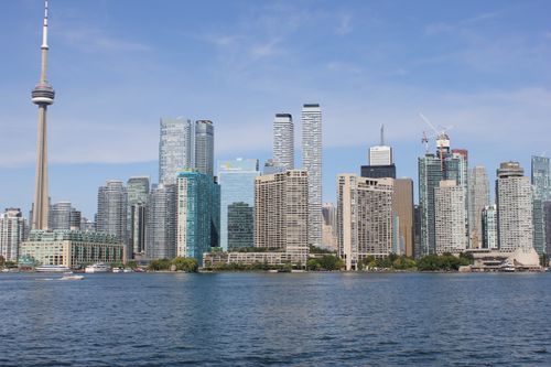 Free A breathtaking view of Toronto's skyline featuring the iconic CN Tower and modern skyscrapers. Stock Photo