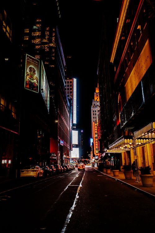 Free A bustling night scene of Times Square, New York, filled with lights and urban architecture. Stock Photo