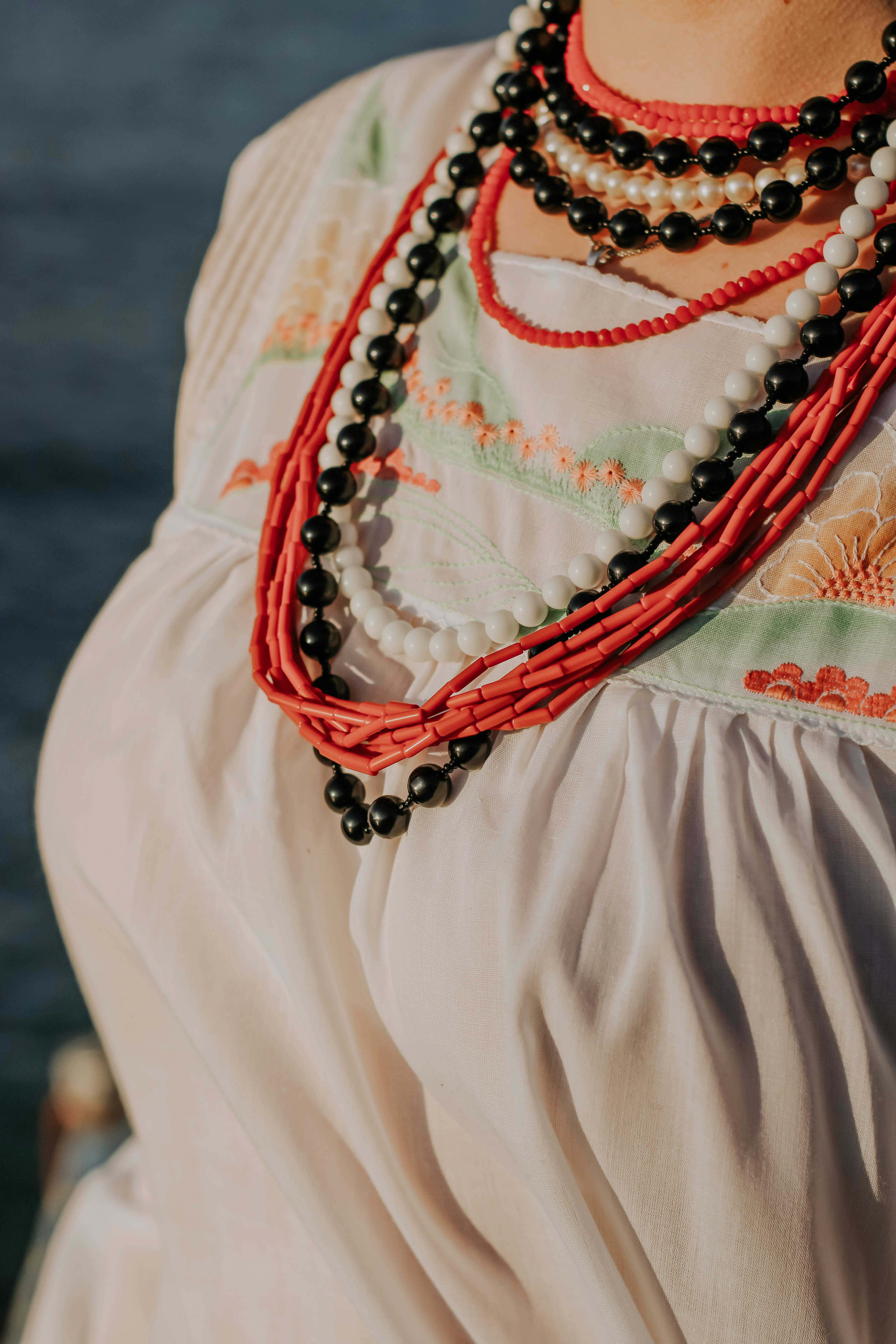 A Woman Wearing Beads Necklace · Free Stock Photo