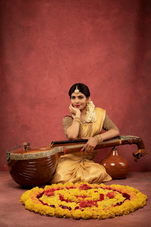 A Woman Posing with a Musical Instrument