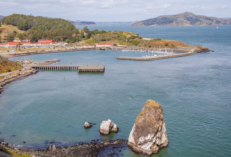 Rock Near Bay With Piers