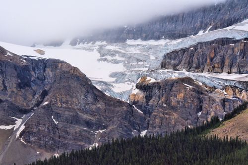 Free Stunning icefields and rugged mountains in Jasper National Park under a cloudy sky. Stock Photo