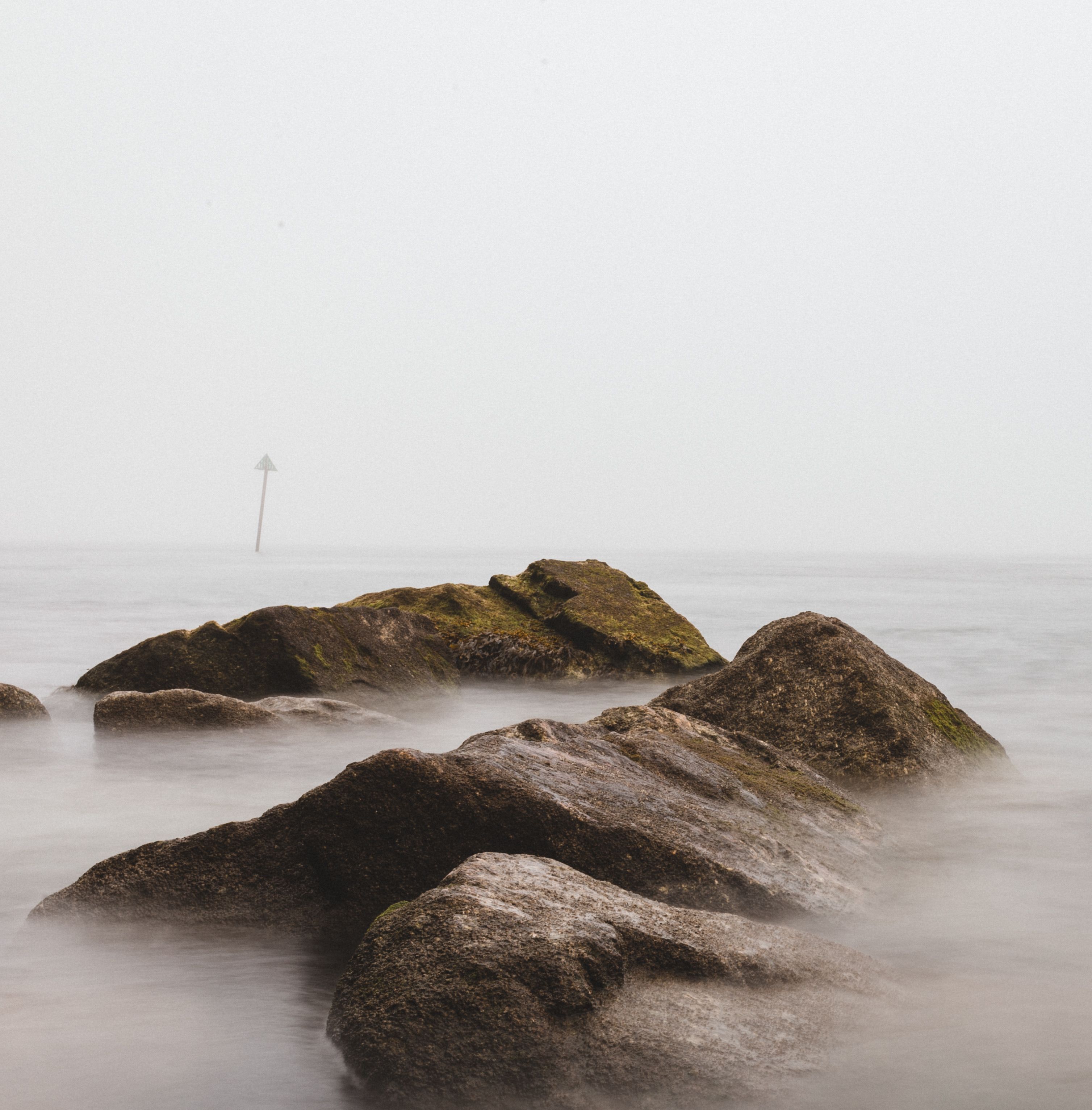 Big Rocks in Sea Under Fog · Free Stock Photo
