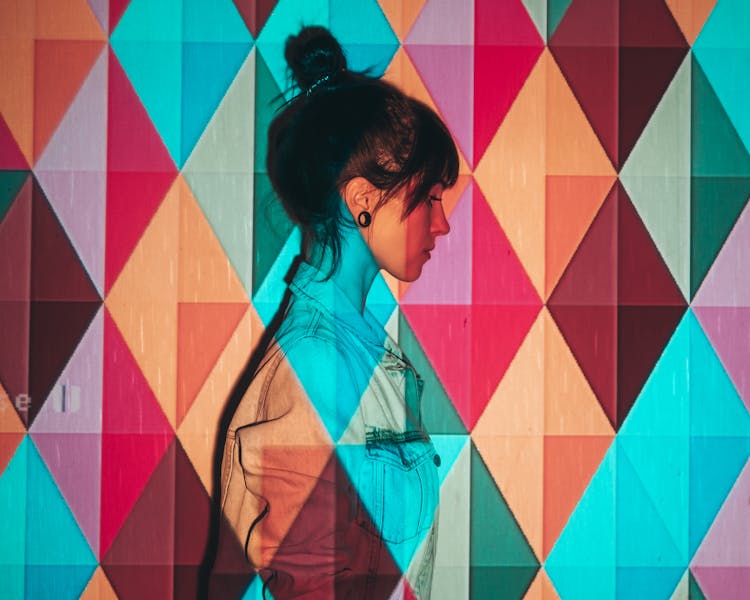 Girl With Colorful Geometric Shadow Background