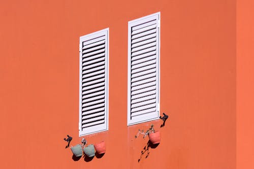 White Wooden Windows in the Red Wall