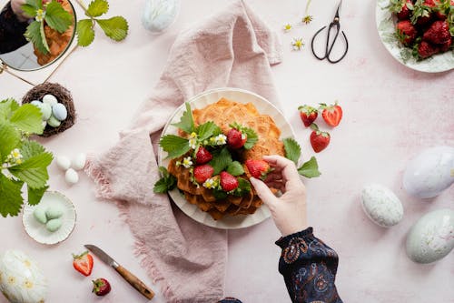 Cake, Strawberries and Eggs on Table