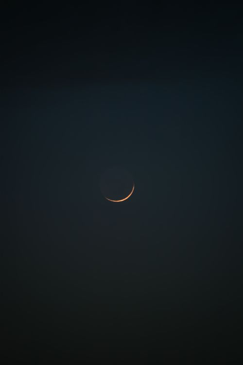 Free Captivating crescent moon shining in the dark night sky over İzmir, Turkey. Stock Photo