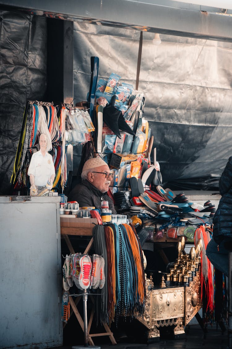 Man Selling At Street Stand