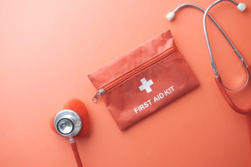 Free Red Leather Pouch on Orange Table Stock Photo