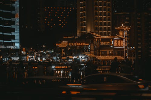 People Walking on the Street During Night Time