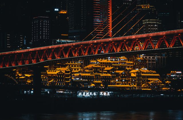 Stunning night scene of Chongqing's illuminated skyline featuring Qiansimen Bridge. — arriving in Chongqing