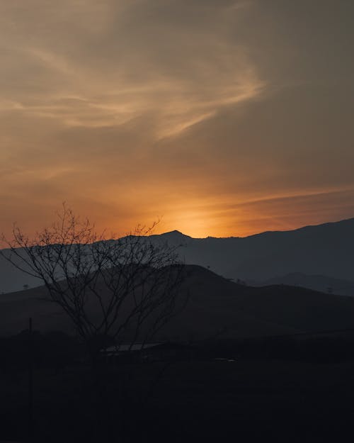 Silhouette of Mountains During Sunset