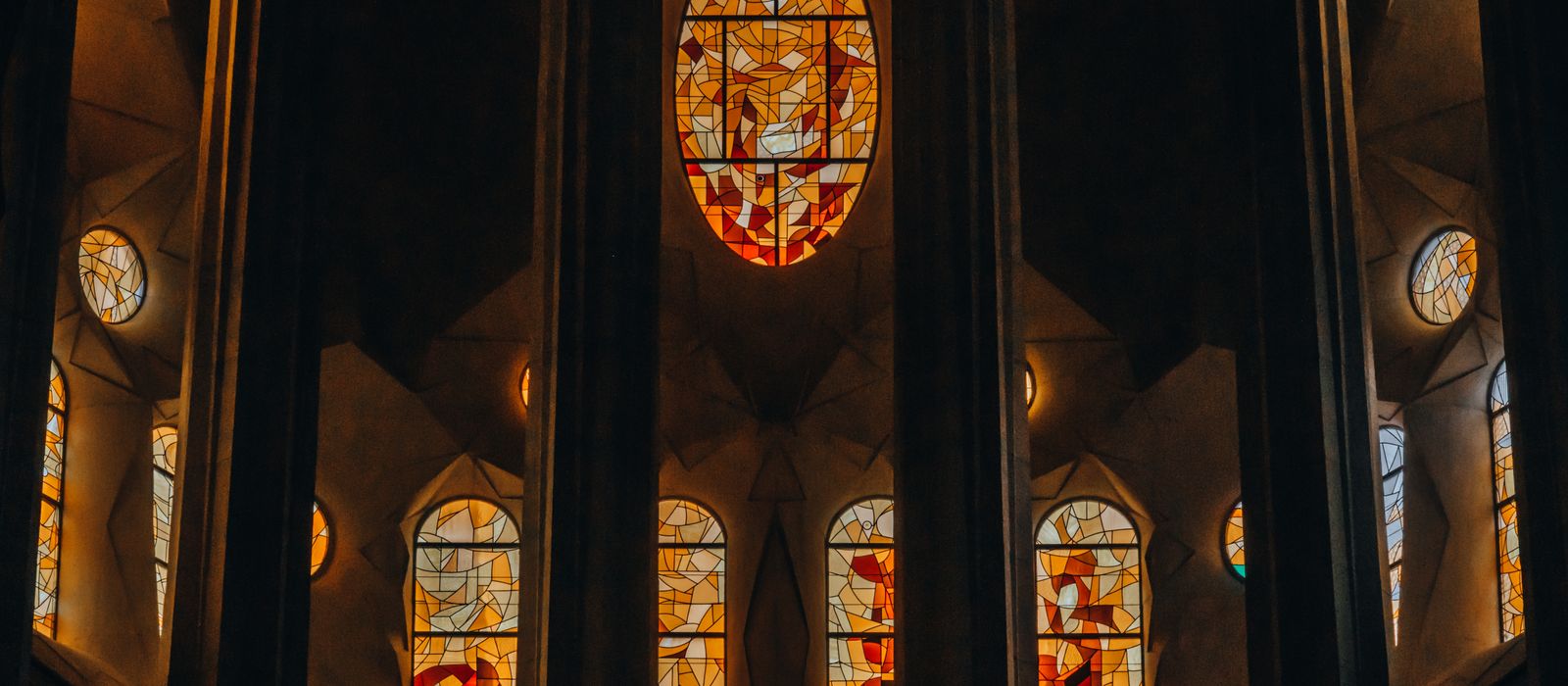 Intricate stained glass windows inside Sagrada Familia, Barcelona.
