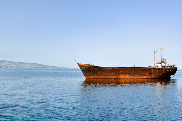 A Rusty Ship On The Water 