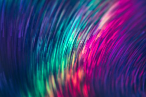 Free A dynamic abstract light pattern with vibrant swirling colors creating a captivating visual effect. Stock Photo