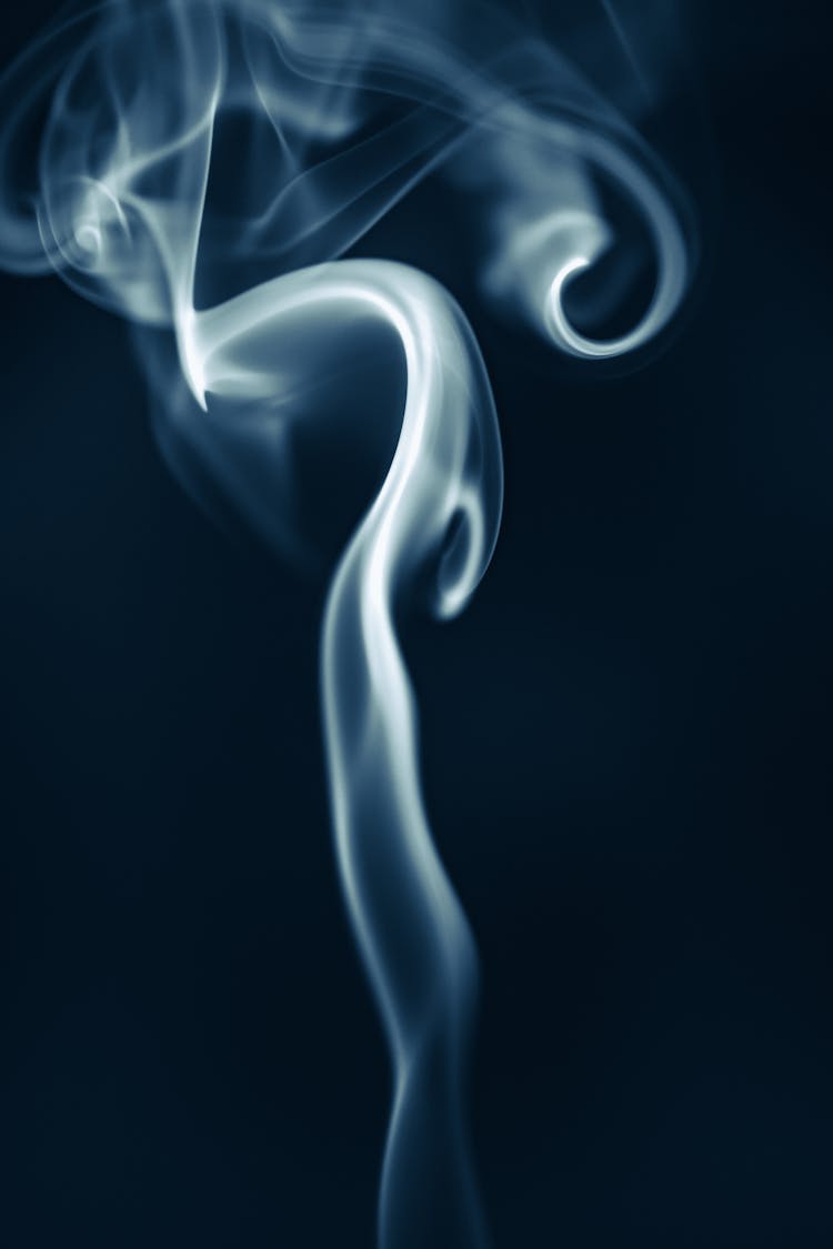 White Smoke In Black Background