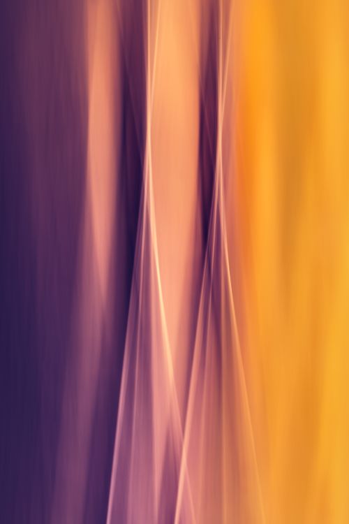 Free Ethereal blend of purple and yellow abstract textures resembling velvet fabric with a vertical flow. Stock Photo