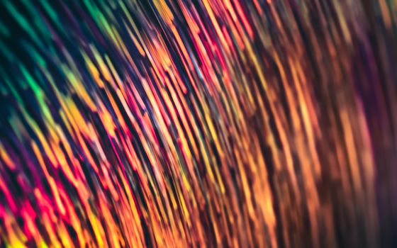 Colorful abstract image with vibrant, shining stripes creating a mesmerizing pattern.