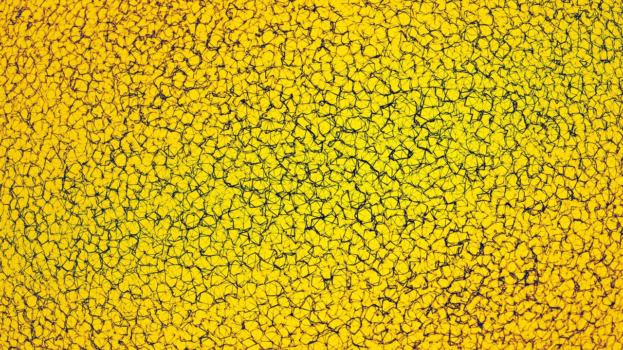 vibrant yellow cracked earth pattern texture for artistic and abstract