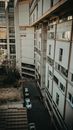 Black Car Parked Beside White Concrete Building
