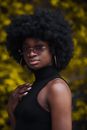 Woman in Black Turtleneck Shirt with Hand on Chest