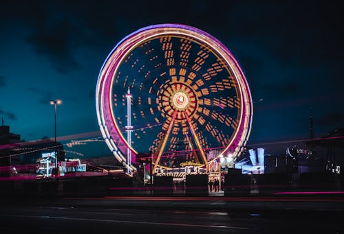 Ferris Wheel With Lights Turned On at Night Time