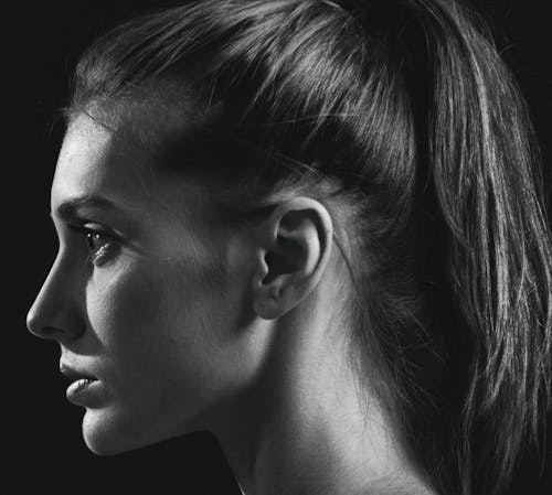 Grayscale Photo of a Woman with Ponytail